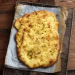 Baked cottage cheese flatbread recipe on parchment paper